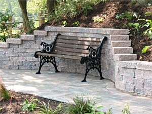 Retaining wall with bench creates a unique sitting area